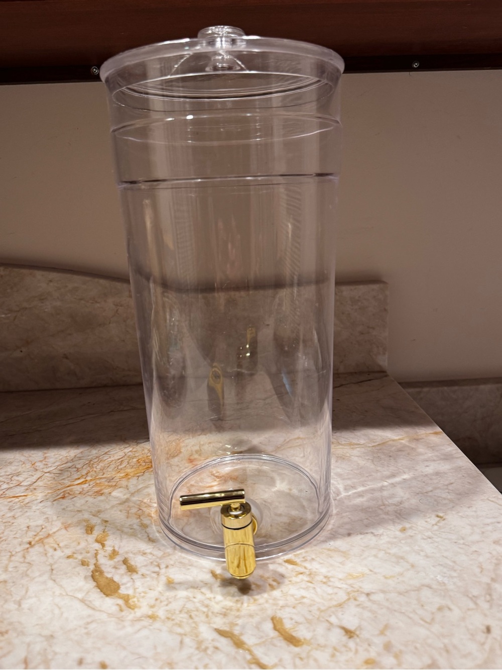Clear 1.6 gallon Acrylic Beverage Dispenser with Gold Spigot.  14” H x 7” W.